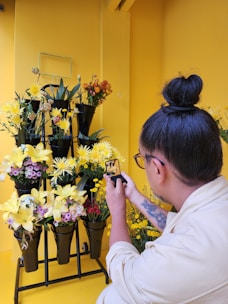 A person using a smartphone to order flowers online.