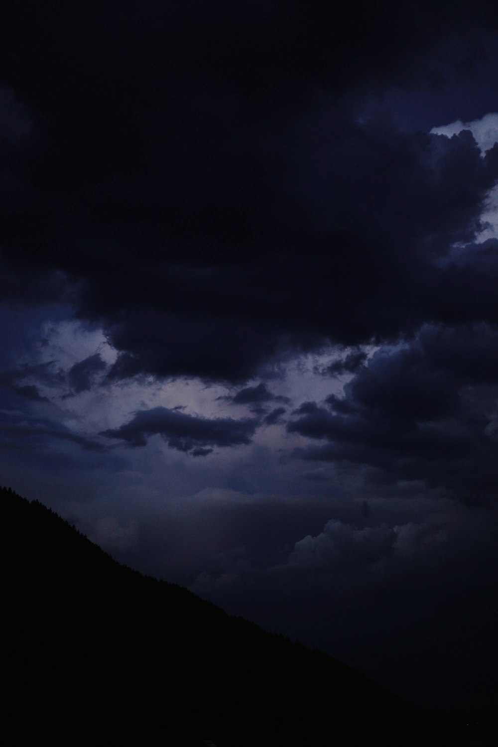 a dark sky with clouds