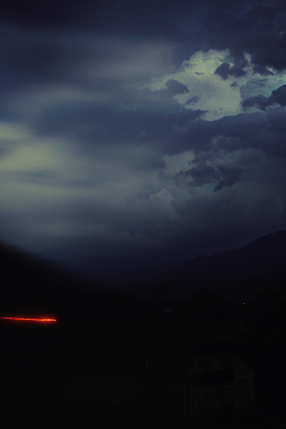 a dark sky with clouds