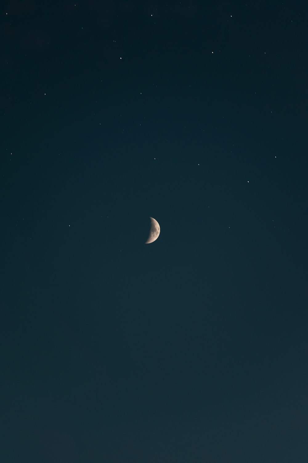 a crescent moon in a dark sky