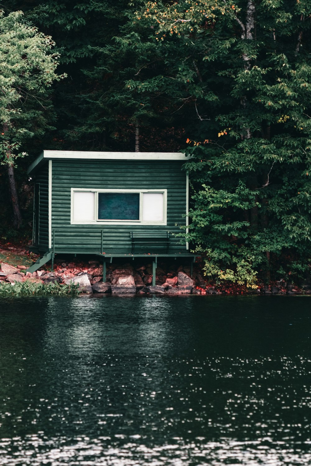 a small house by a lake