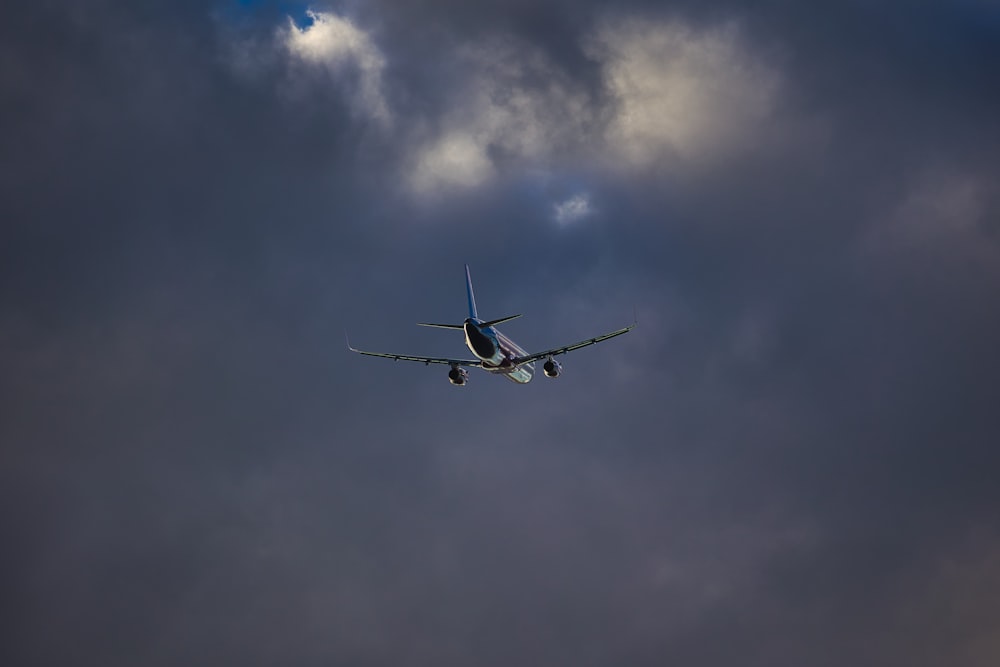 a small airplane flying in the sky