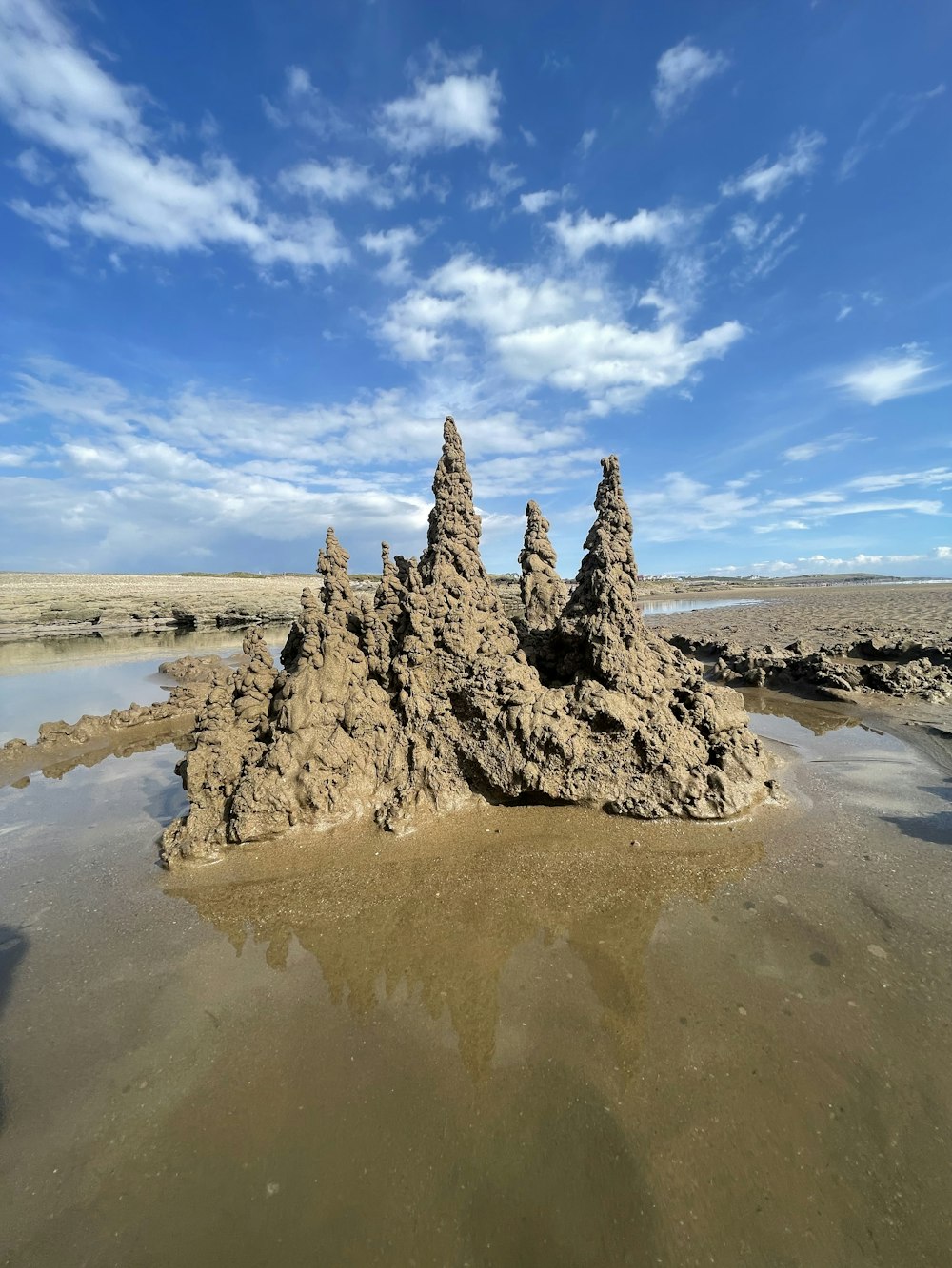 a large rock in a body of water