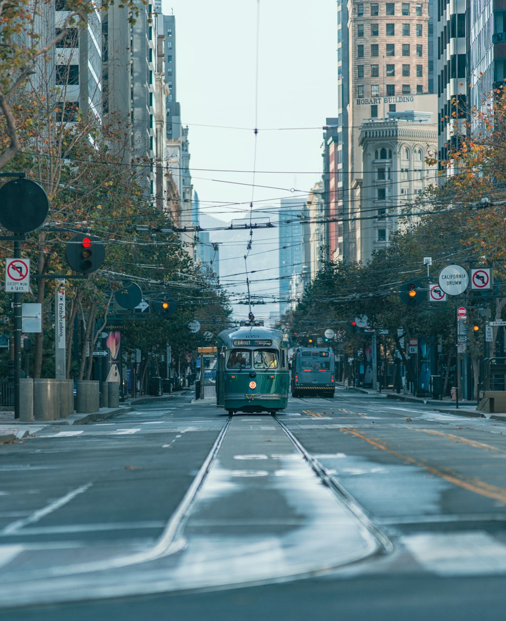 a couple of trolleys on a city street