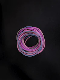 Stacks of colorful o-rings in different sizes displayed in a warehouse.