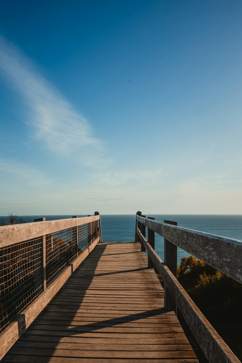 a wooden walkway over water