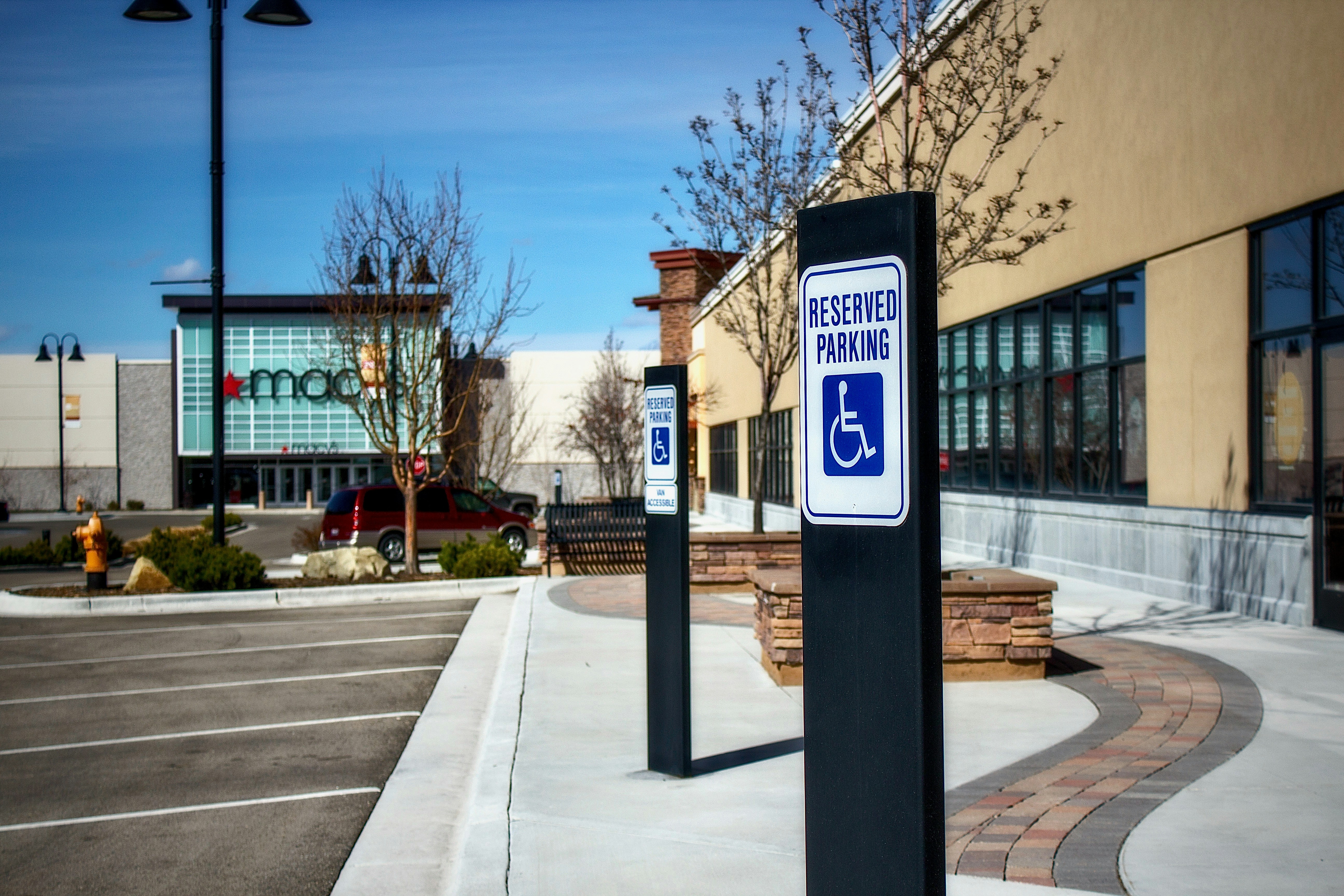 Electric work van plugged into a fast charging station