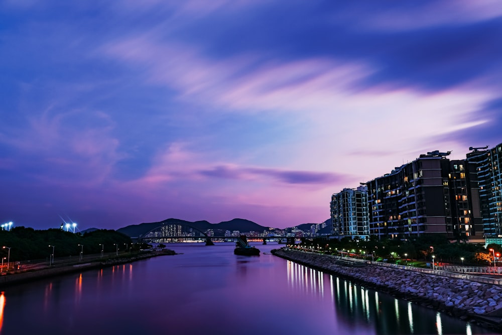 a body of water with buildings along it