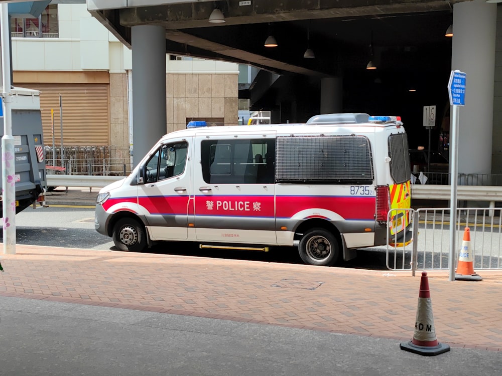 a white van parked under a bridge