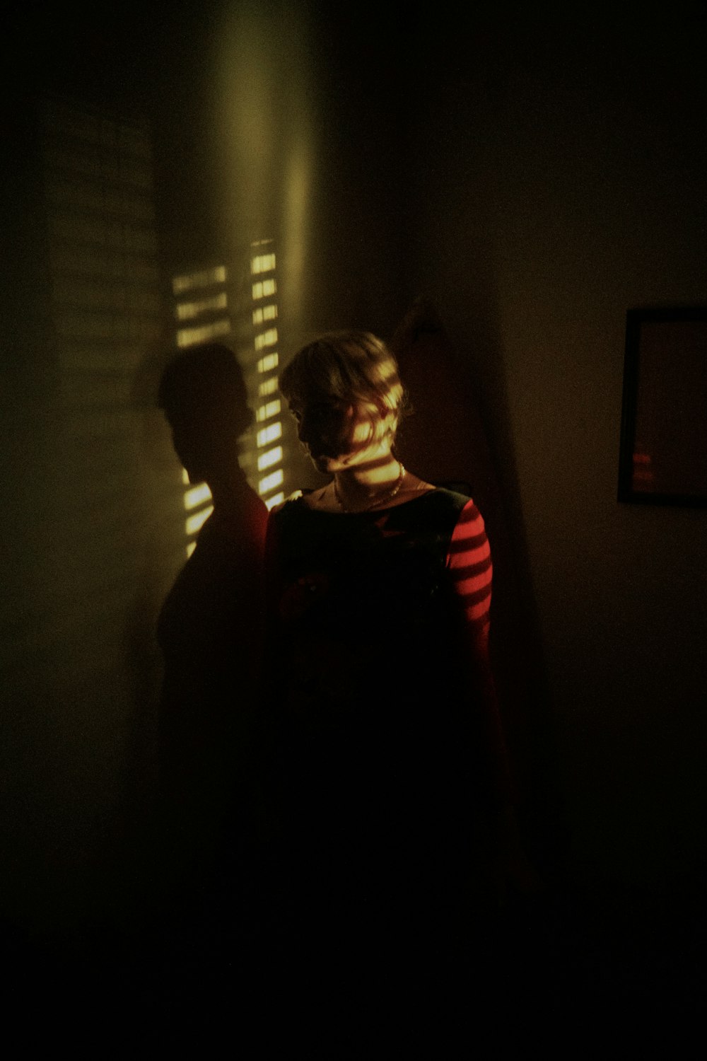 a boy in a dark room