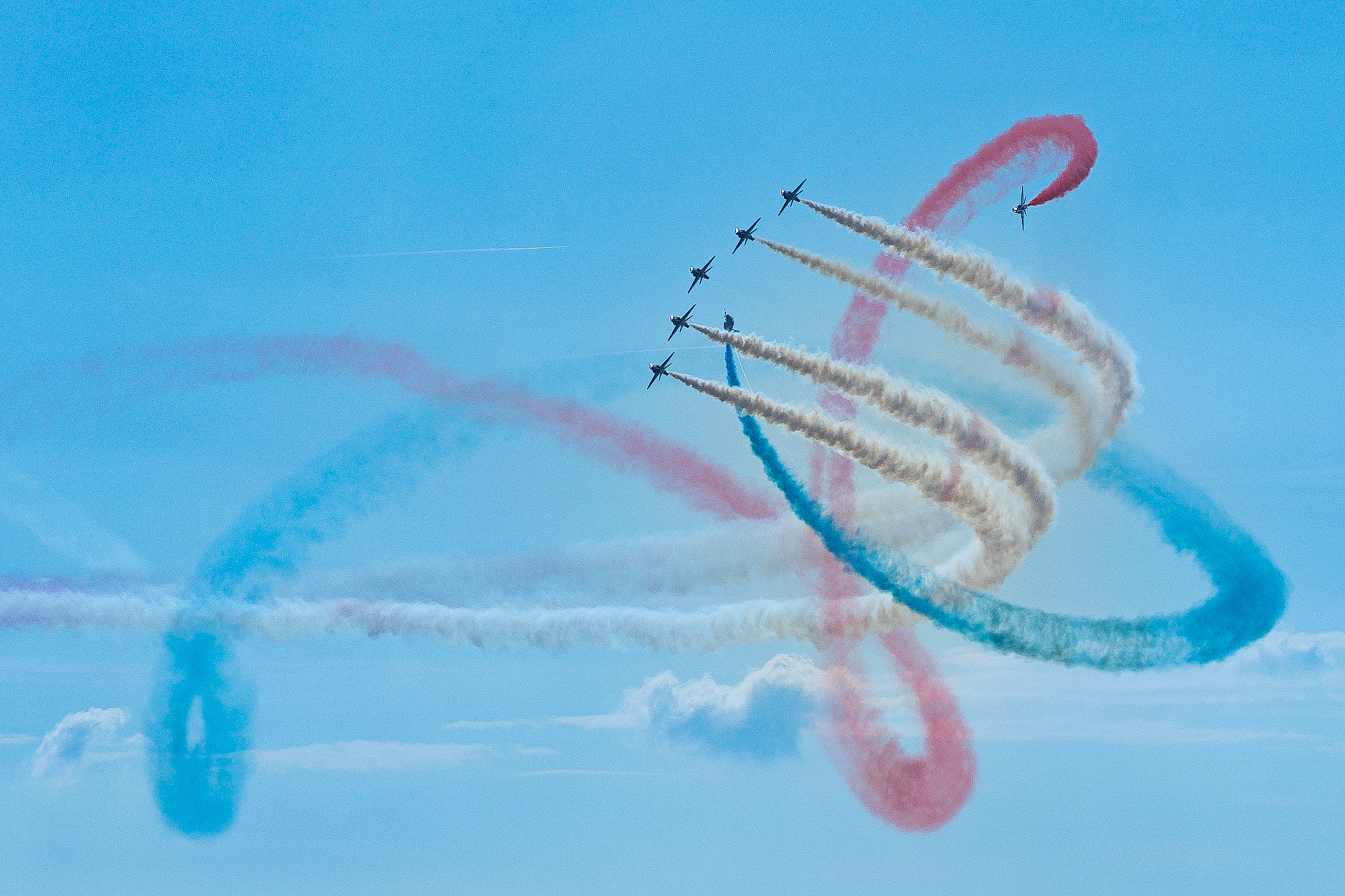 a group of airplanes flying in the sky, The world famous RAF Red Arrows Display Team.