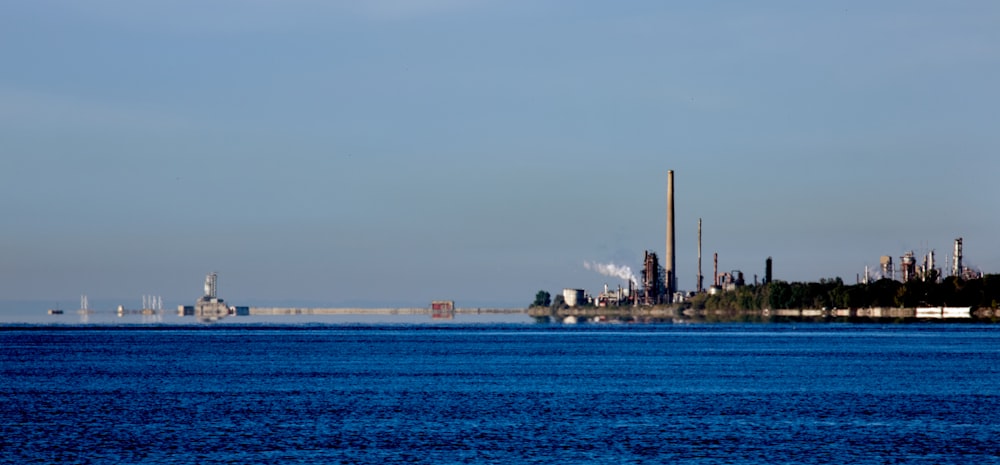 a body of water with a city in the background