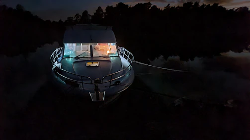Advanced marine electronics dashboard glowing softly on a dusk fishing trip.