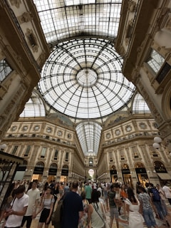 a large group of people inside a large building with Galleria Vittorio Emanuele II in the background