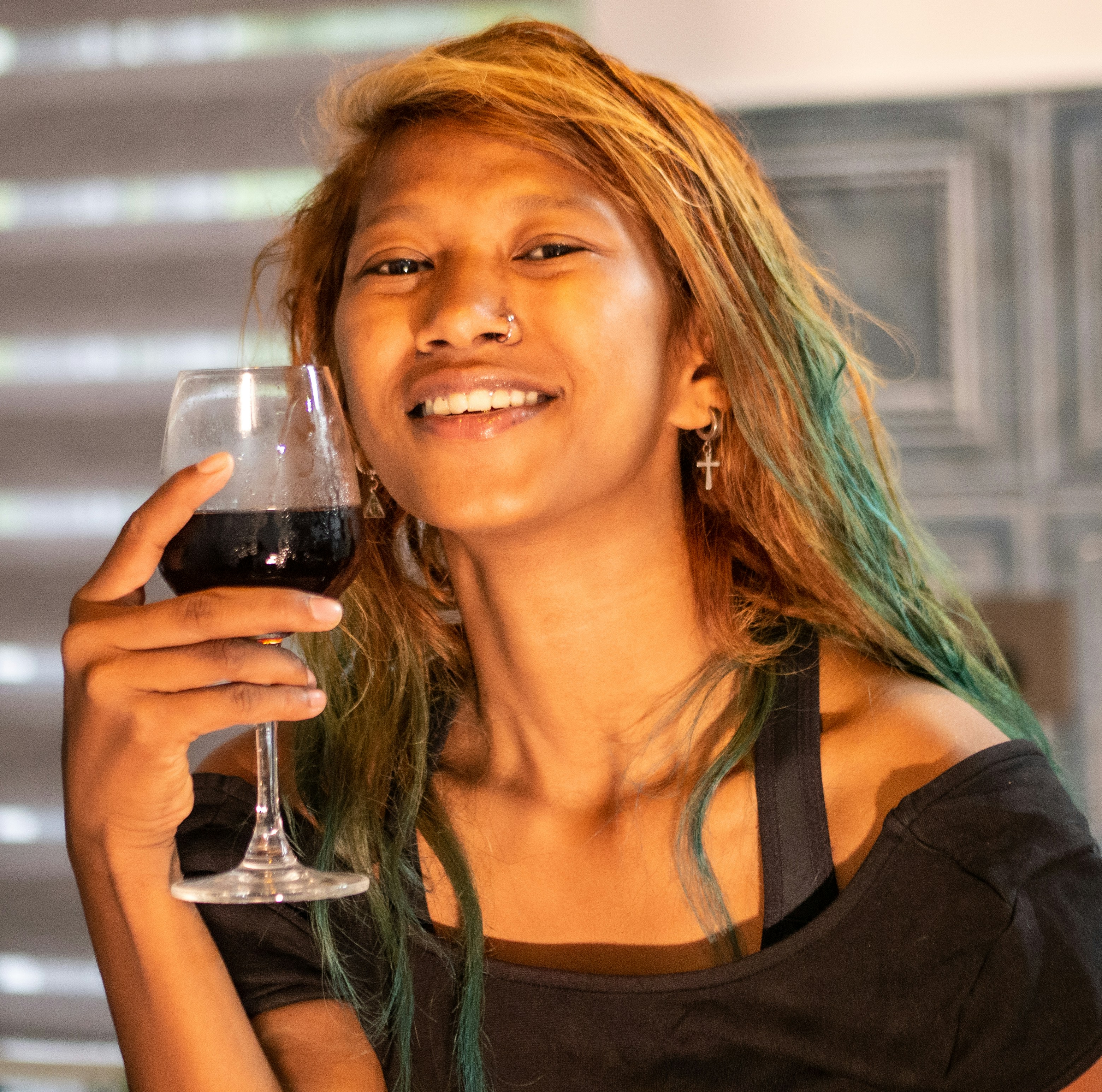 a woman holding a glass of wine