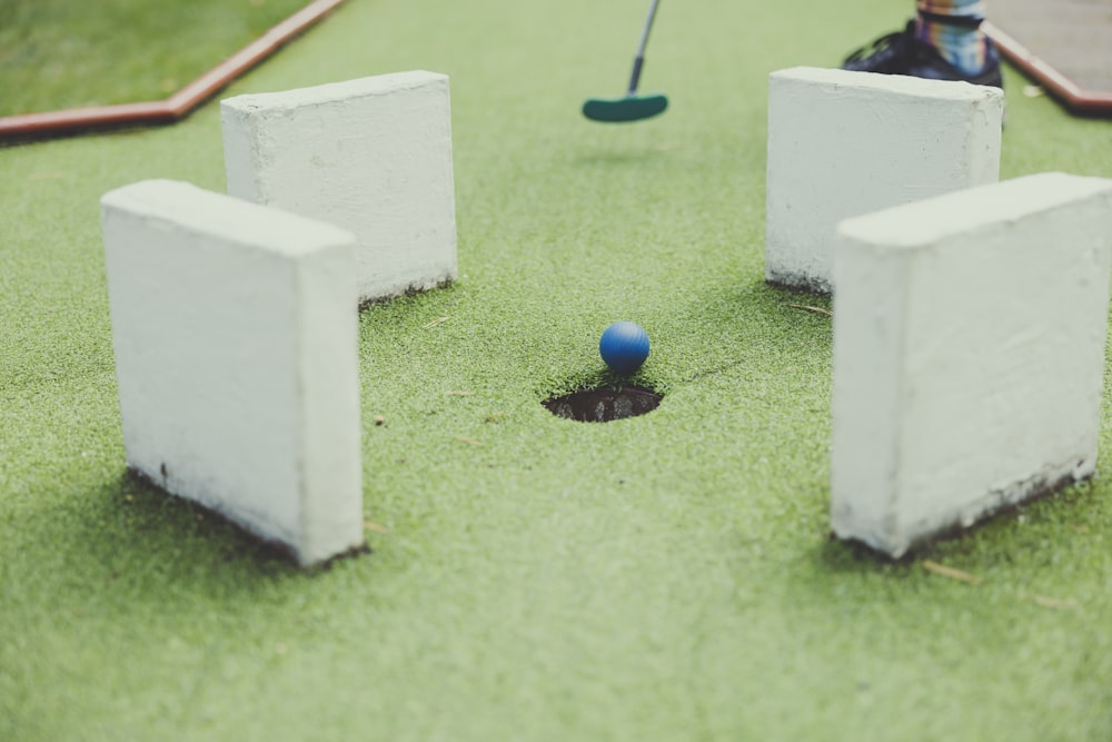 a blue ball in a white box