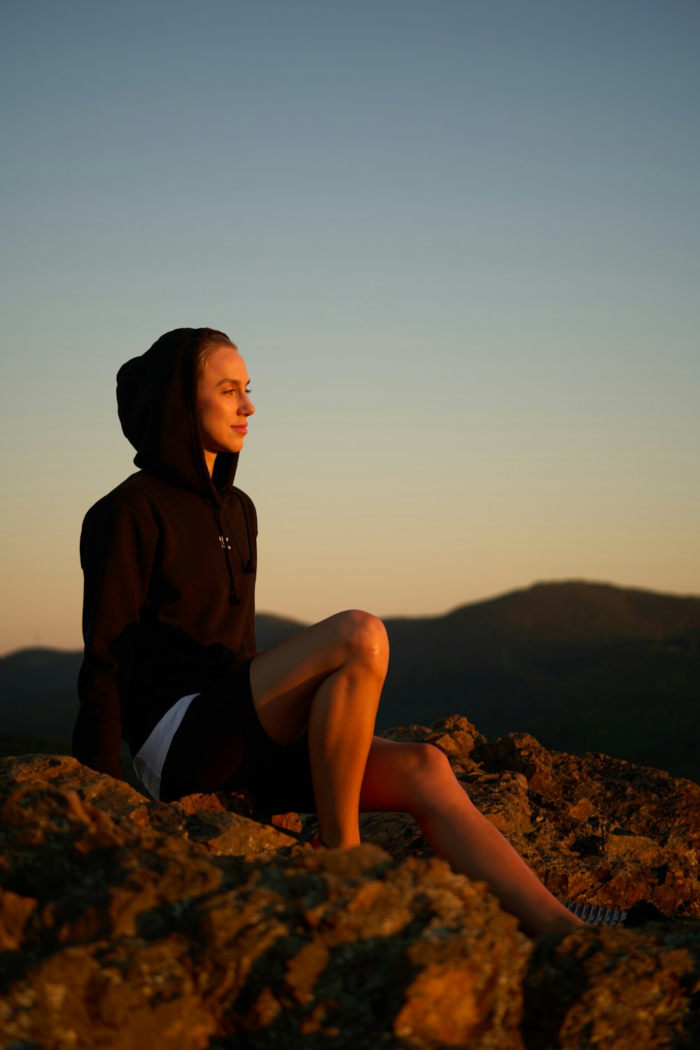 a man sitting on a rock