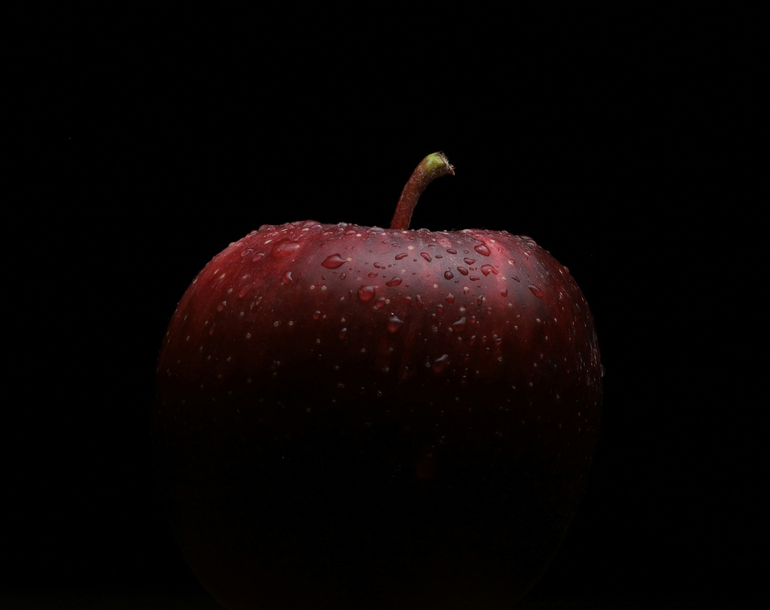a red apple with a stem