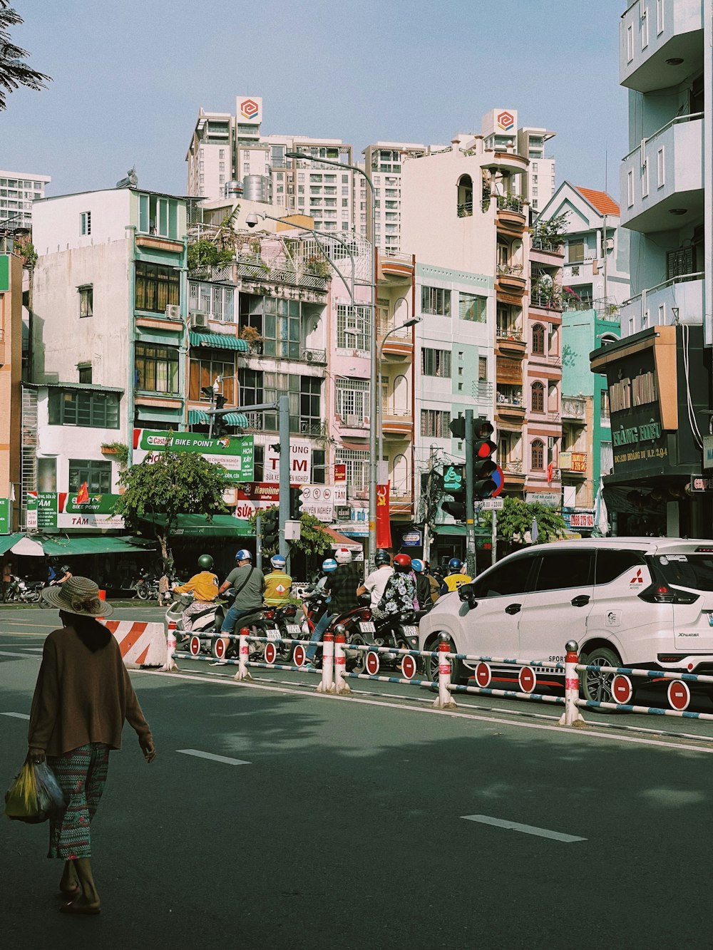 a parade with people and cars