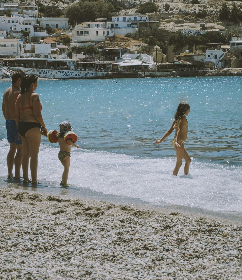 a group of people on a beach