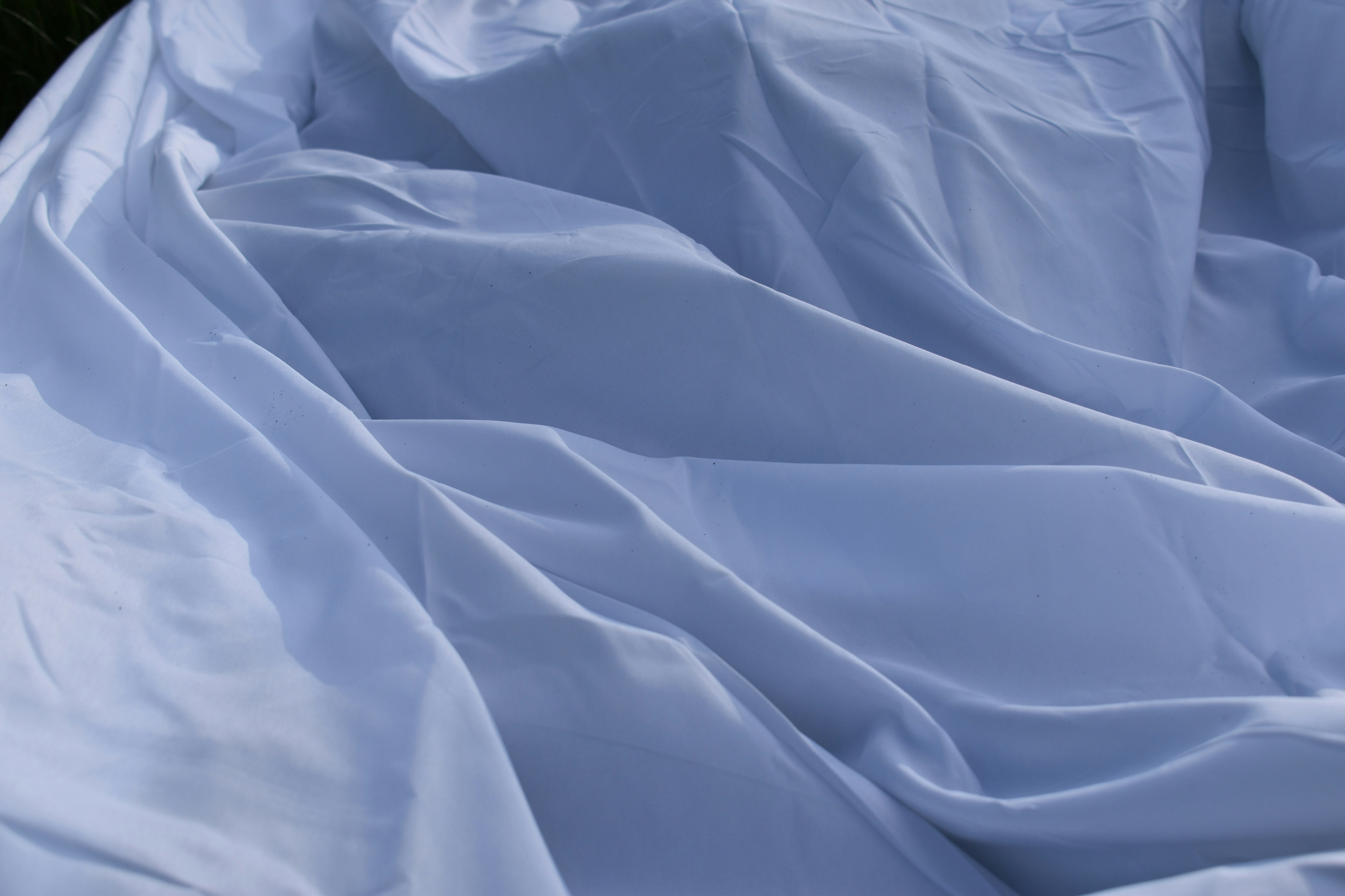 A close up of a white sheet photo Free Grey Image on Unsplash