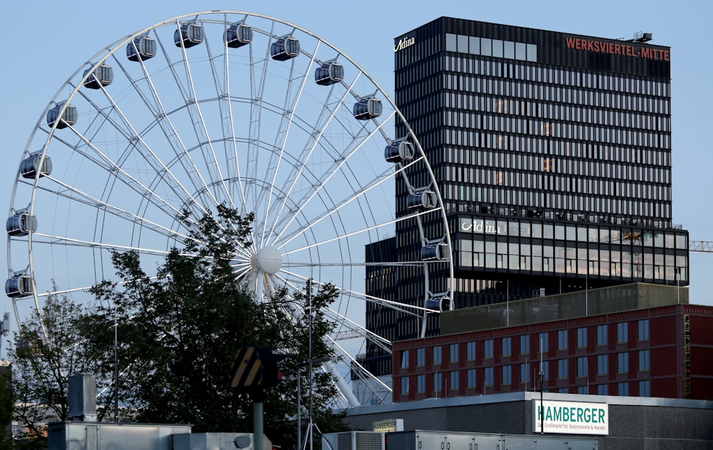 a ferris wheel next to a building