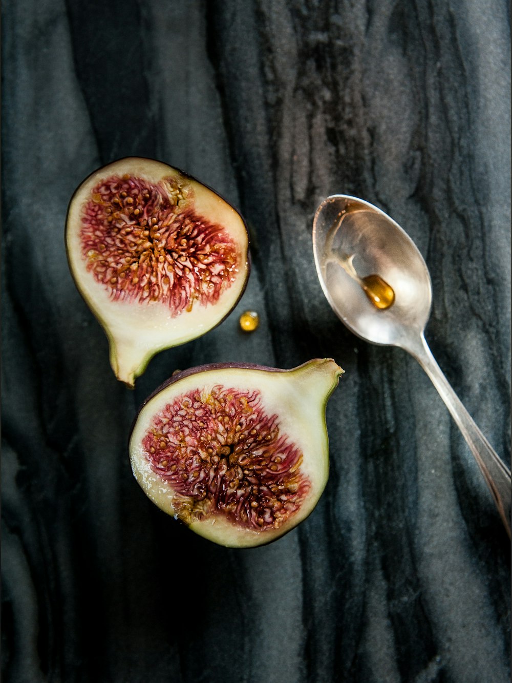 a piece of fruit with a spoon