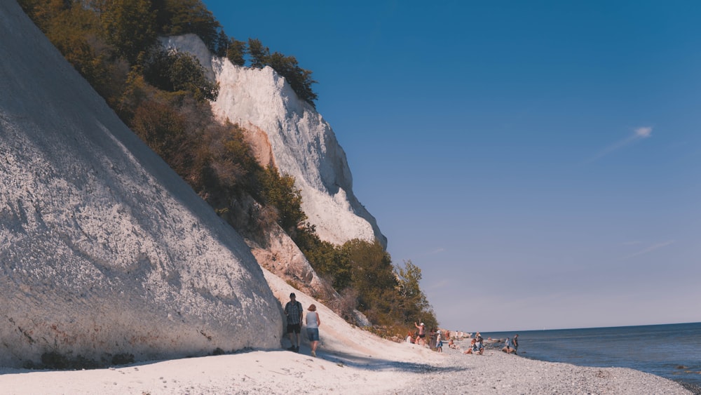 people walking on a beach