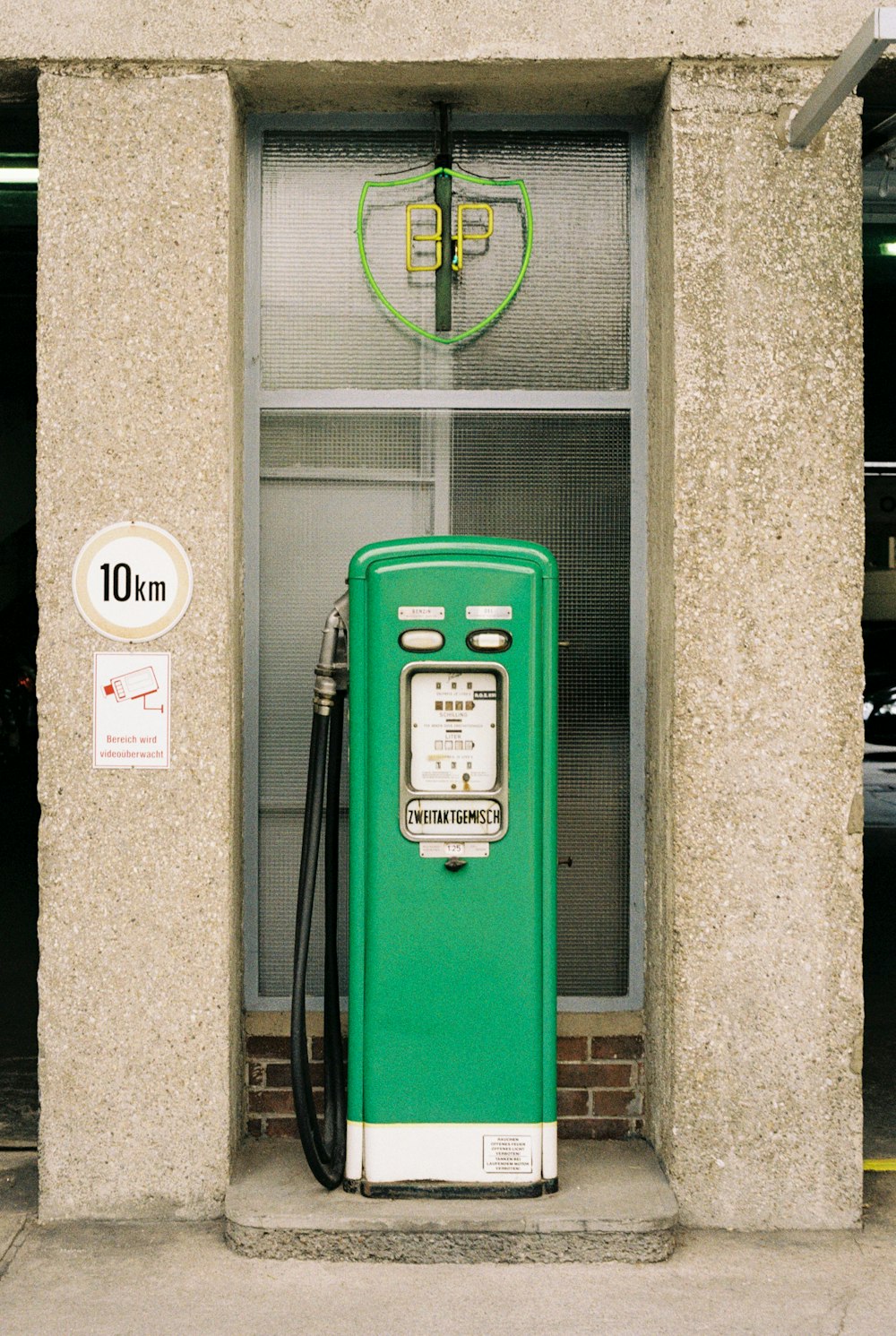 a green door with a sign on it