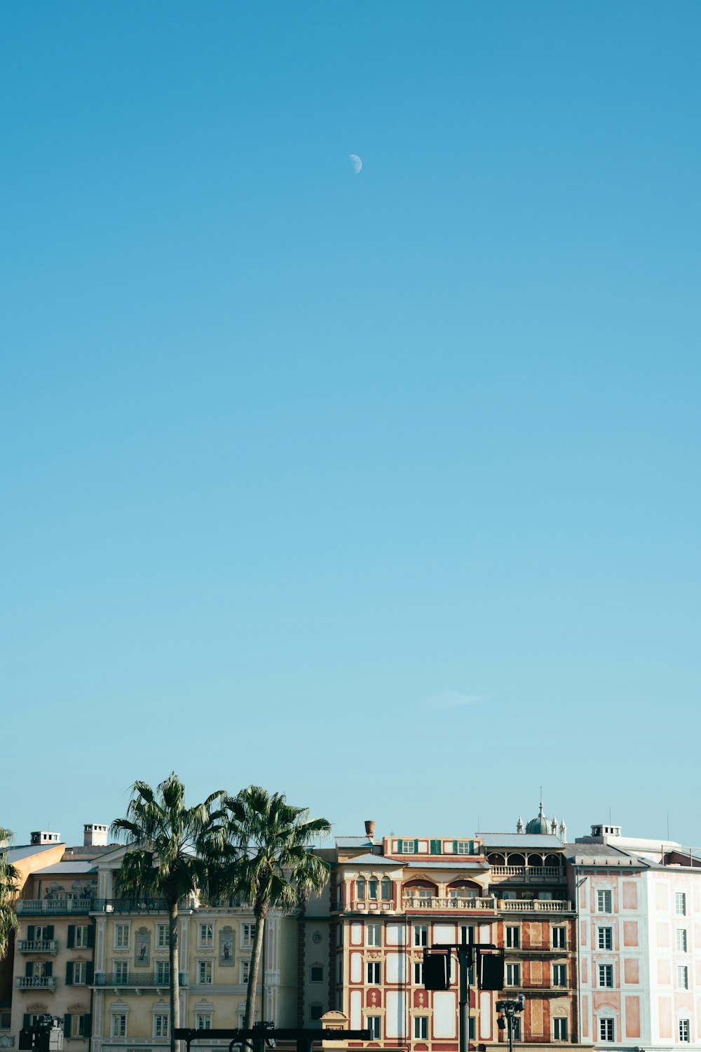 a group of buildings with trees in the front