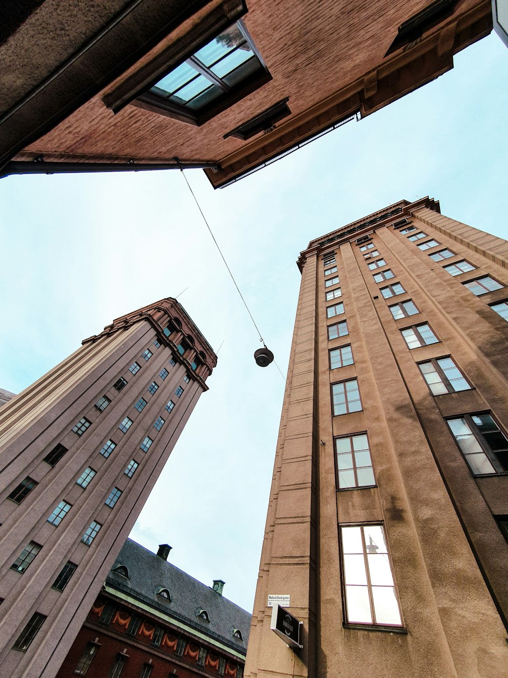 a view looking up at a tall building from below