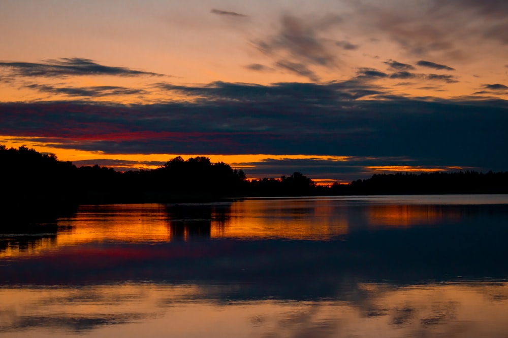 a sunset over a lake