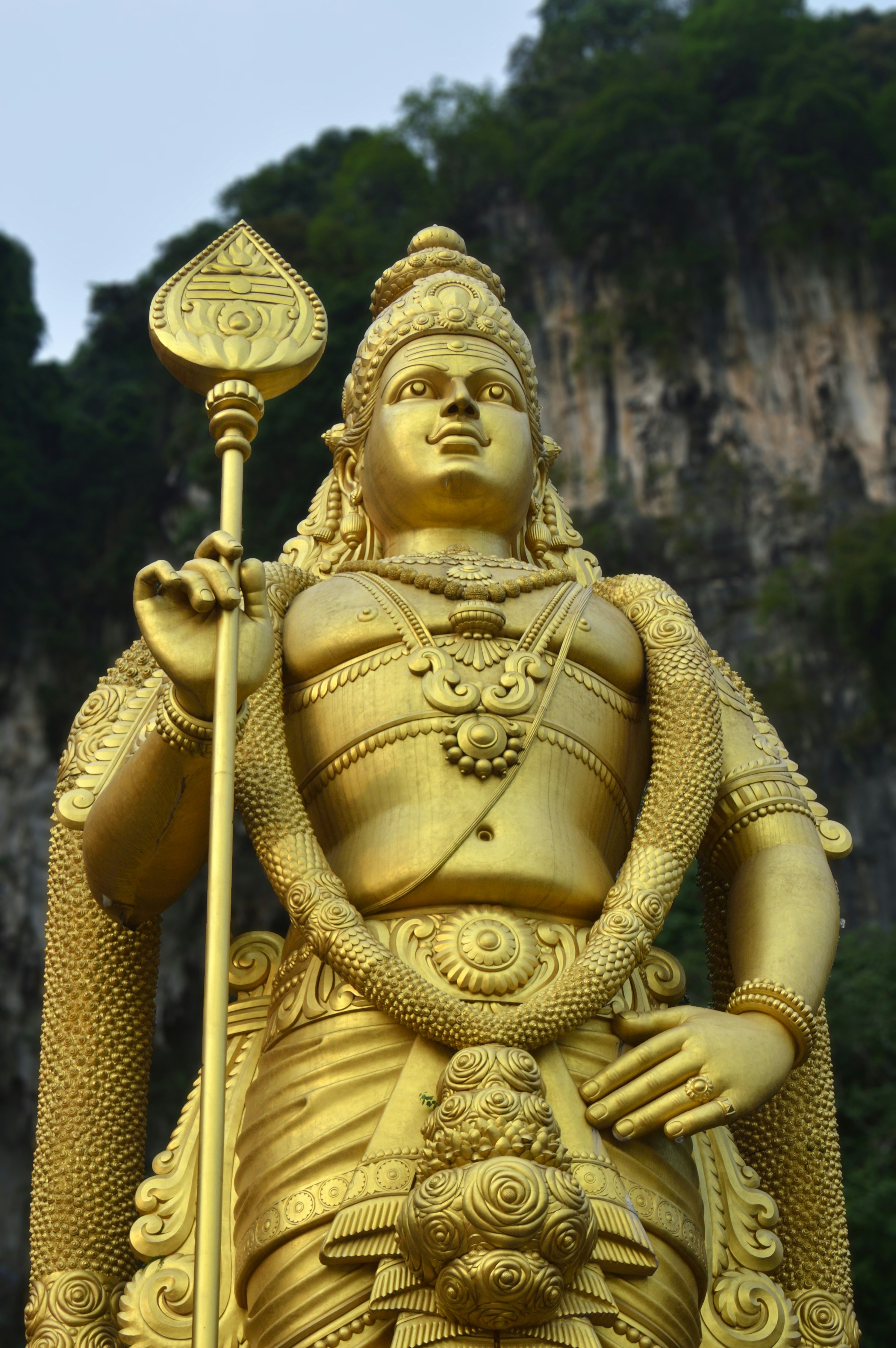 A statue of a person holding a staff