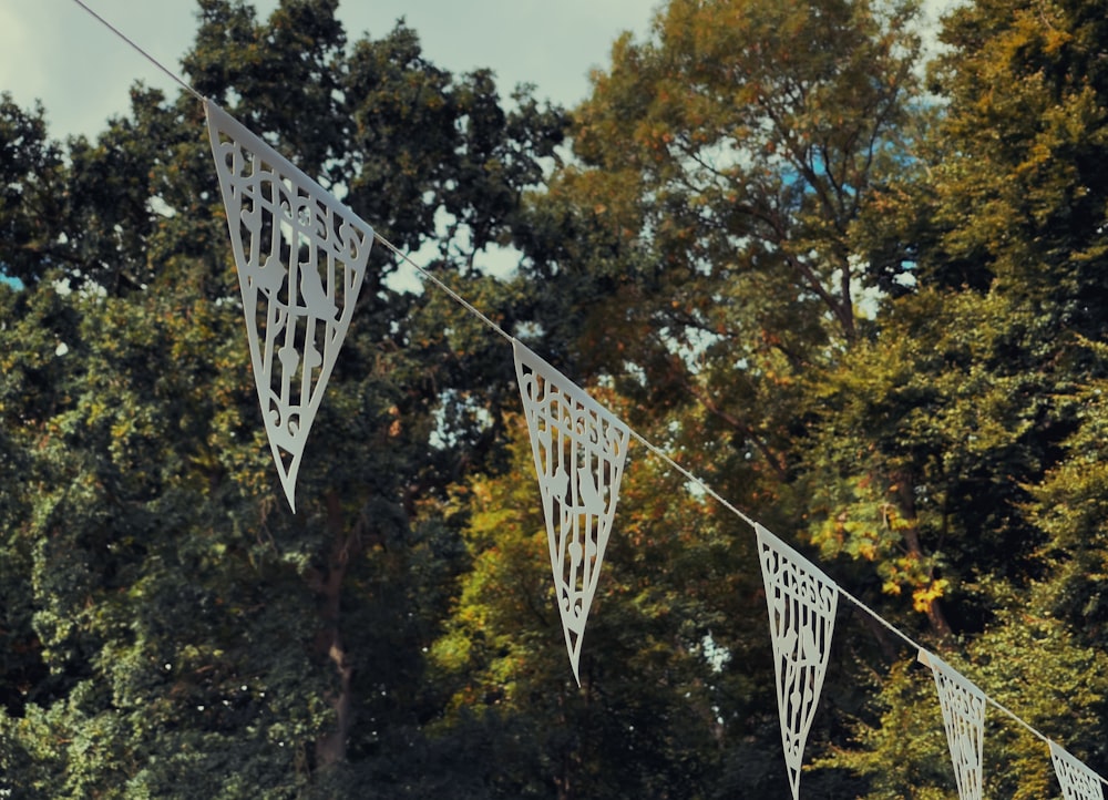 a sign with trees in the background