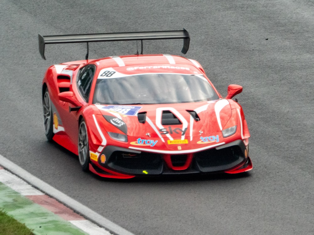 a red race car on a track