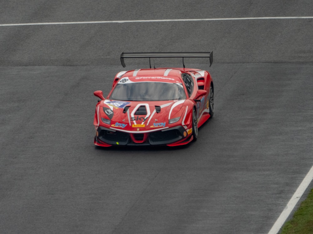 a red race car on a track