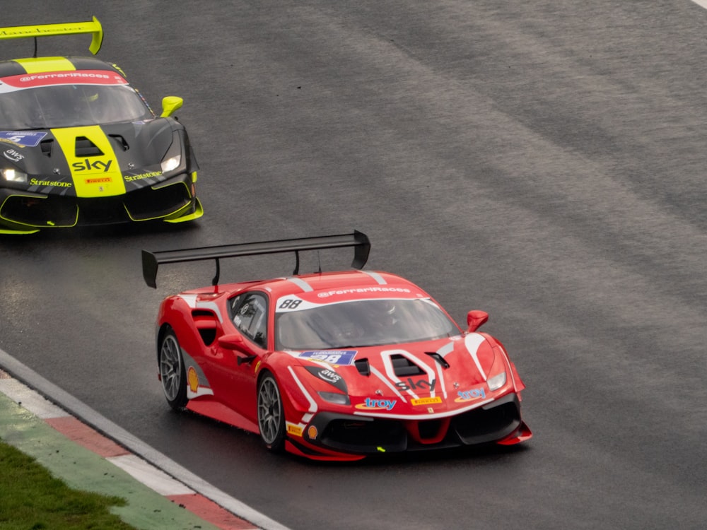 a couple of race cars on a race track