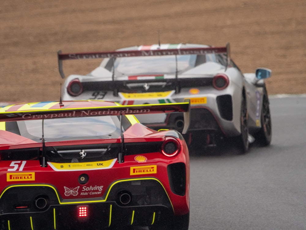 a couple of race cars on a track