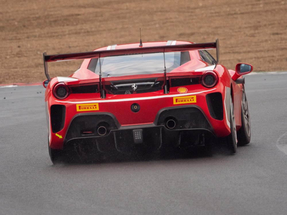 a red race car on a road