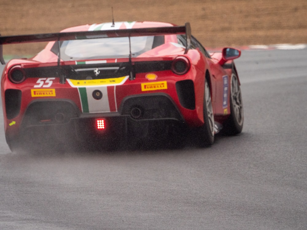 a red race car on a track