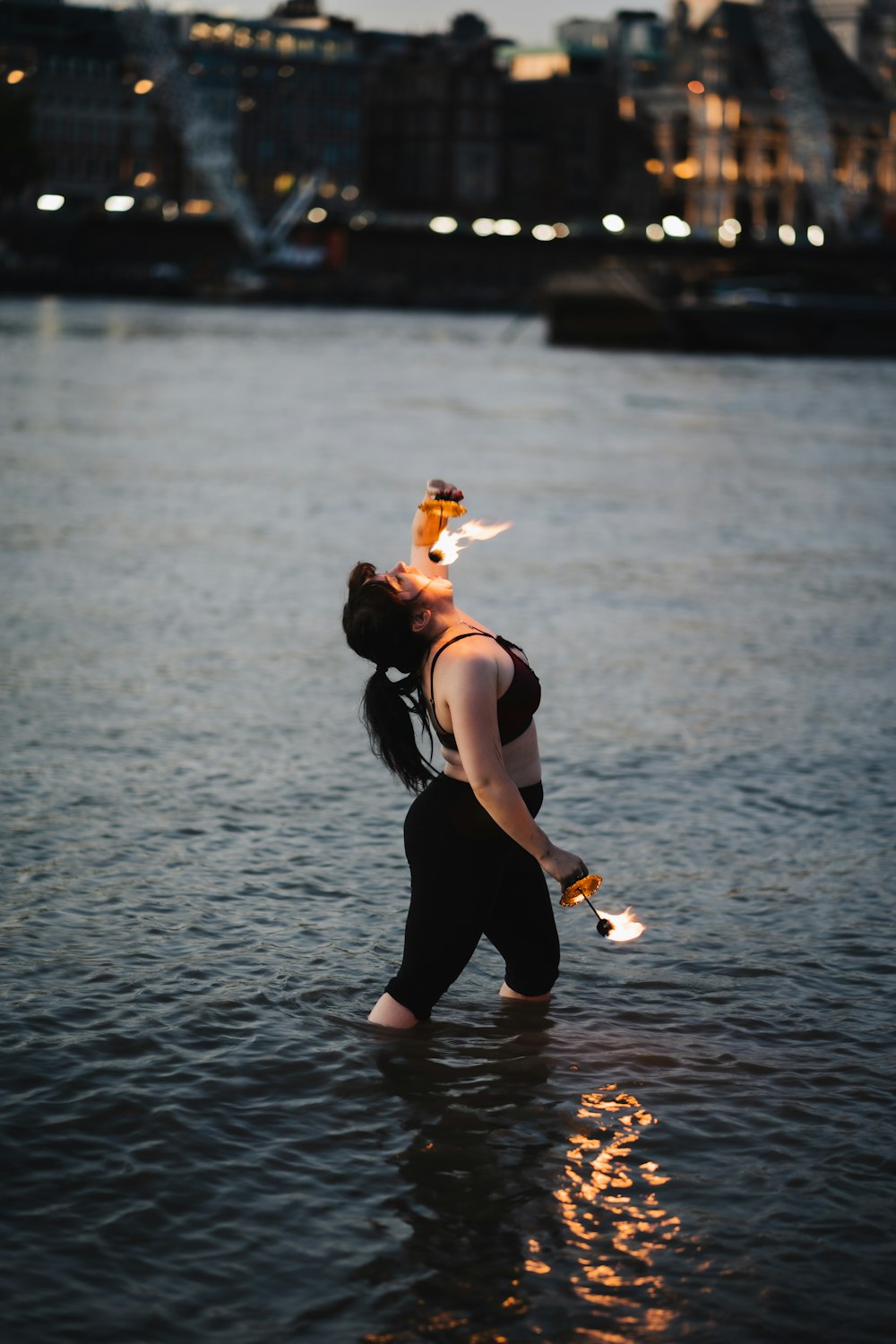 a man holding a fish in water