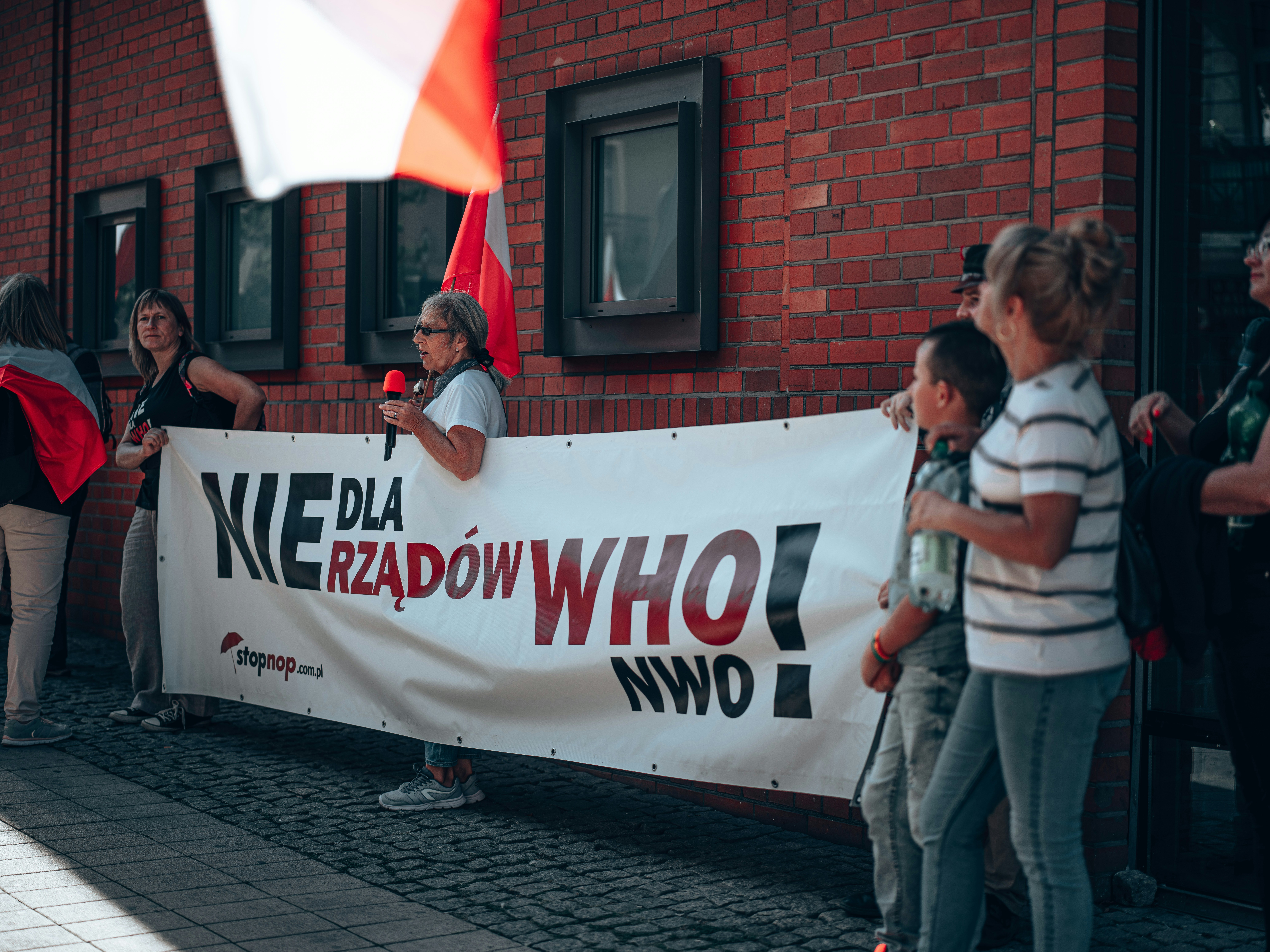a group of people holding a banner