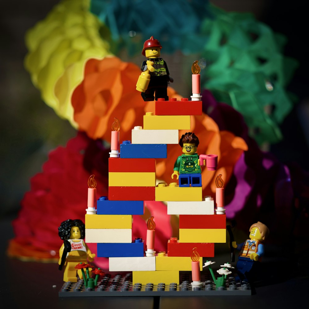 A toy house with a group of people on it photo – Free Lego Image on Unsplash