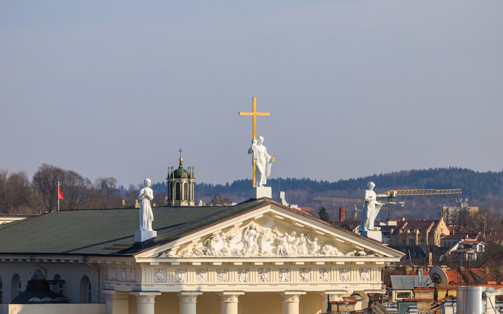 a building with statues on top