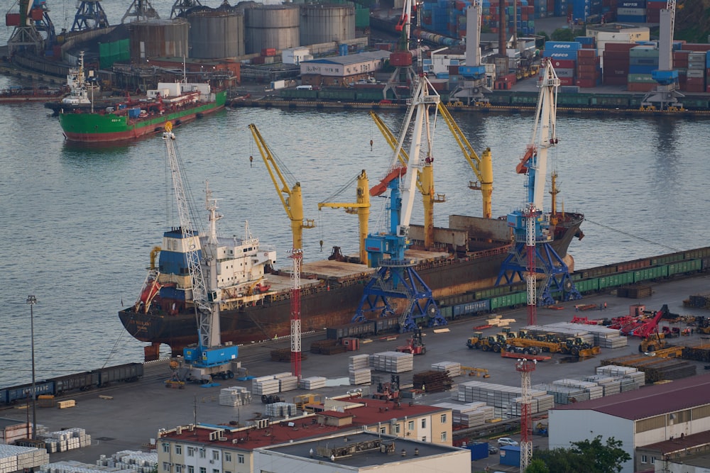 a group of cranes in a harbor