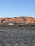 a group of vehicles parked in a desert
