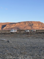 a group of vehicles parked in a desert