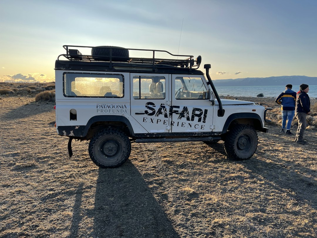 a white vehicle with a rack on top of it, Nativo Experience El Calafate