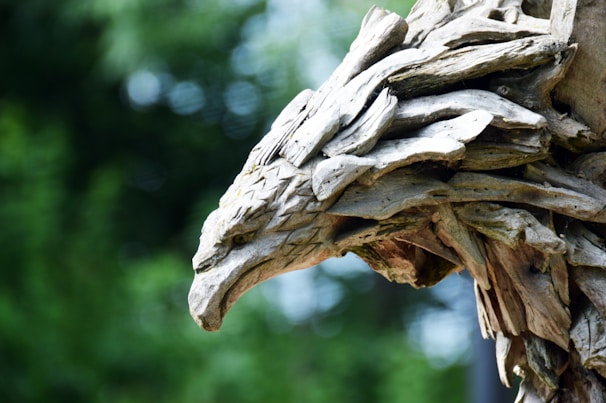 Close-up of a finely carved native American eagle sculpture made from rich beetle kill pine wood.