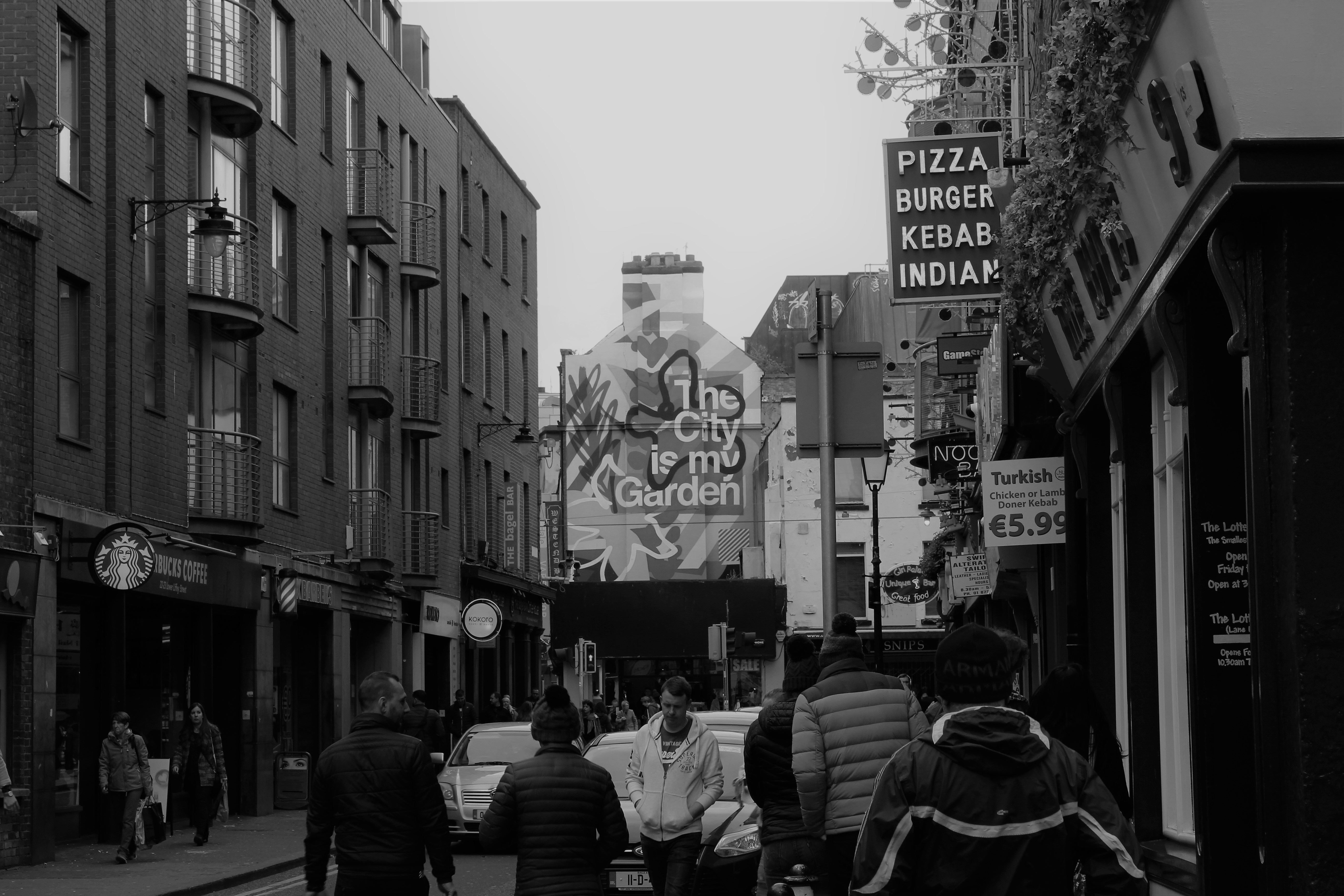 a group of people walking down a street
